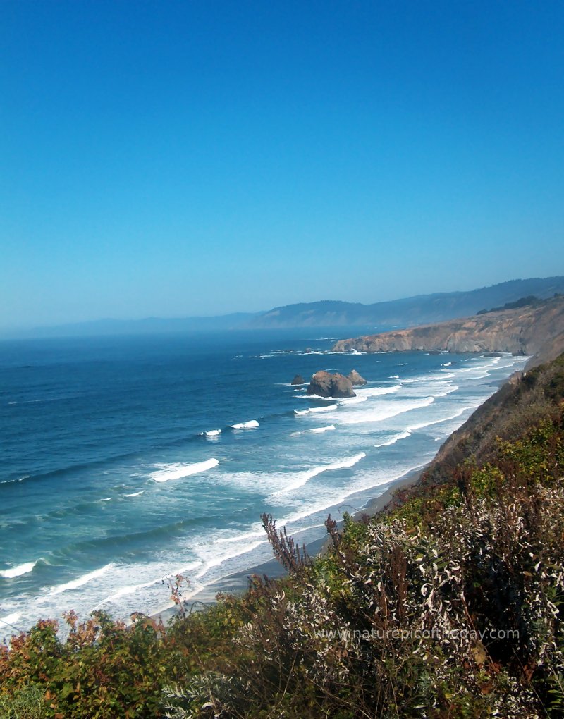 long rolling waves on the coast of northern california.