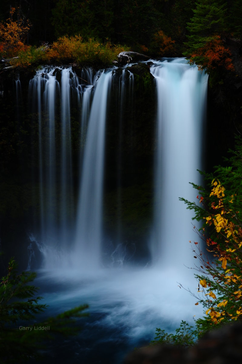 Gorgeous professional photograph of Koosah Falls in Oregon.