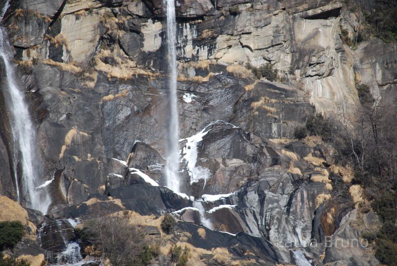 Waterfall with snow in Italy.