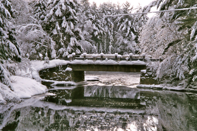 Stone bridge covered in snow and ice