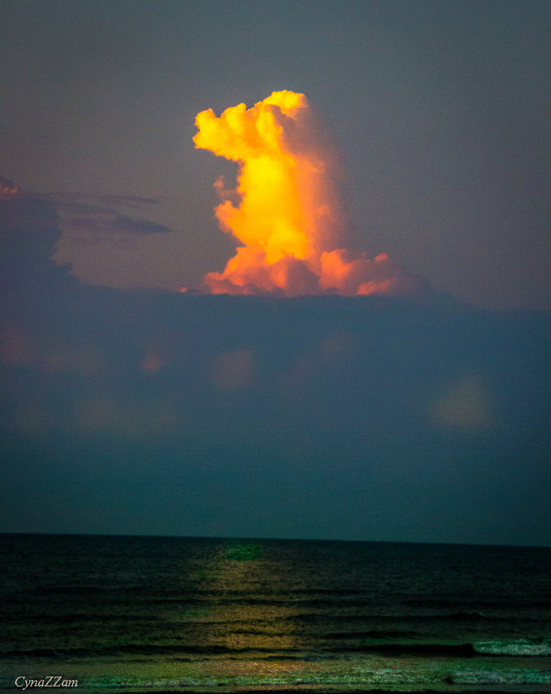 A cloud pillar rises above the Gulf