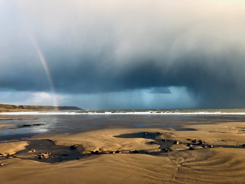 Rainbow on the beach in South Wales, UK