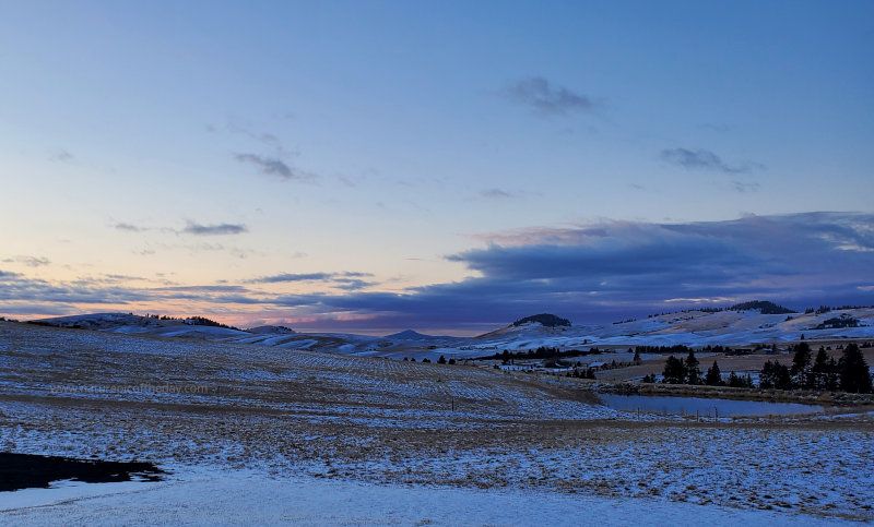 Sunset over a light dusting of snow