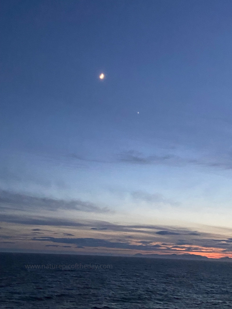 The moon and Venus over Alaska.